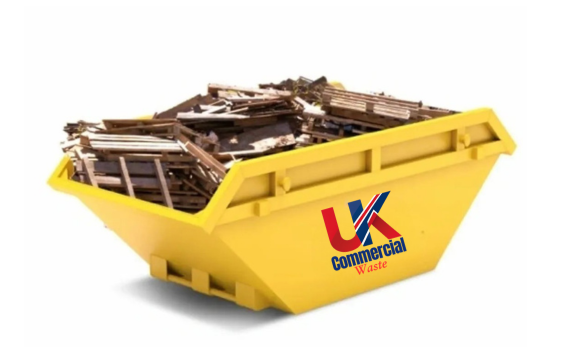 Wood Waste Skip Yellow skip filled with wood and debris.