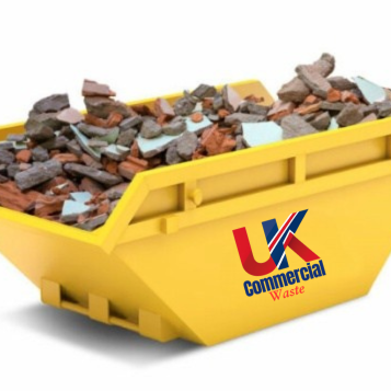 Skips and Rear End Loader A yellow skip filled with mixed construction debris and broken materials.