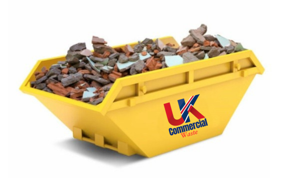 Inert Waste Yellow skip bin filled with construction debris and broken materials.