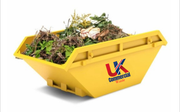 Garden Waste Skip A yellow waste skip filled with garden debris and organic materials.