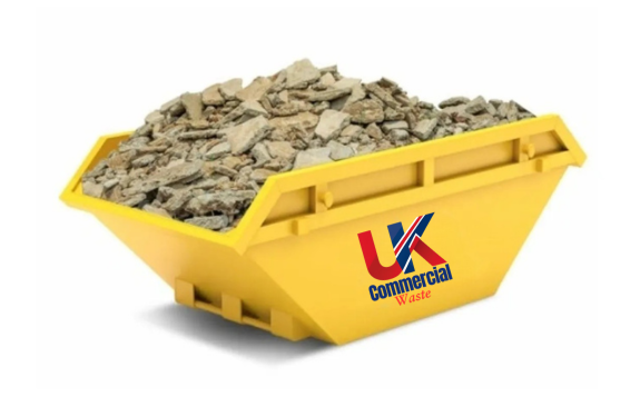 Hardcore Skip A yellow skip bin filled with construction debris and rubble.