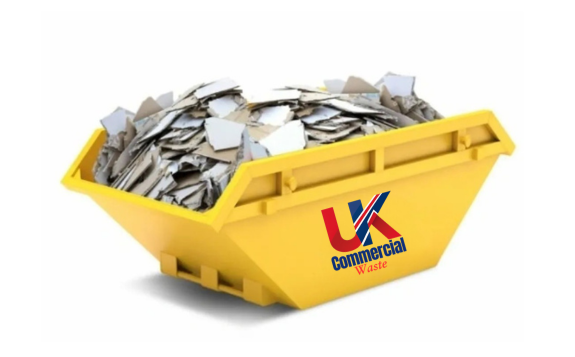 Plasterboard Skip A bright yellow skip filled with plasterboard.